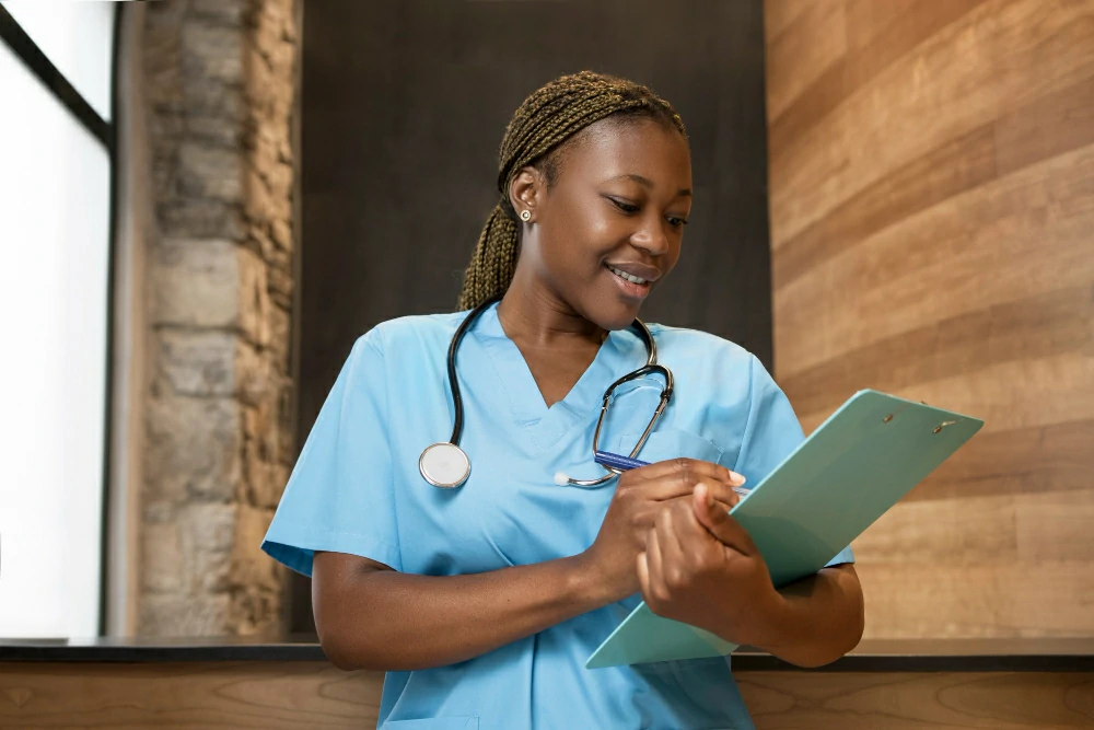 nurse with note pad studying