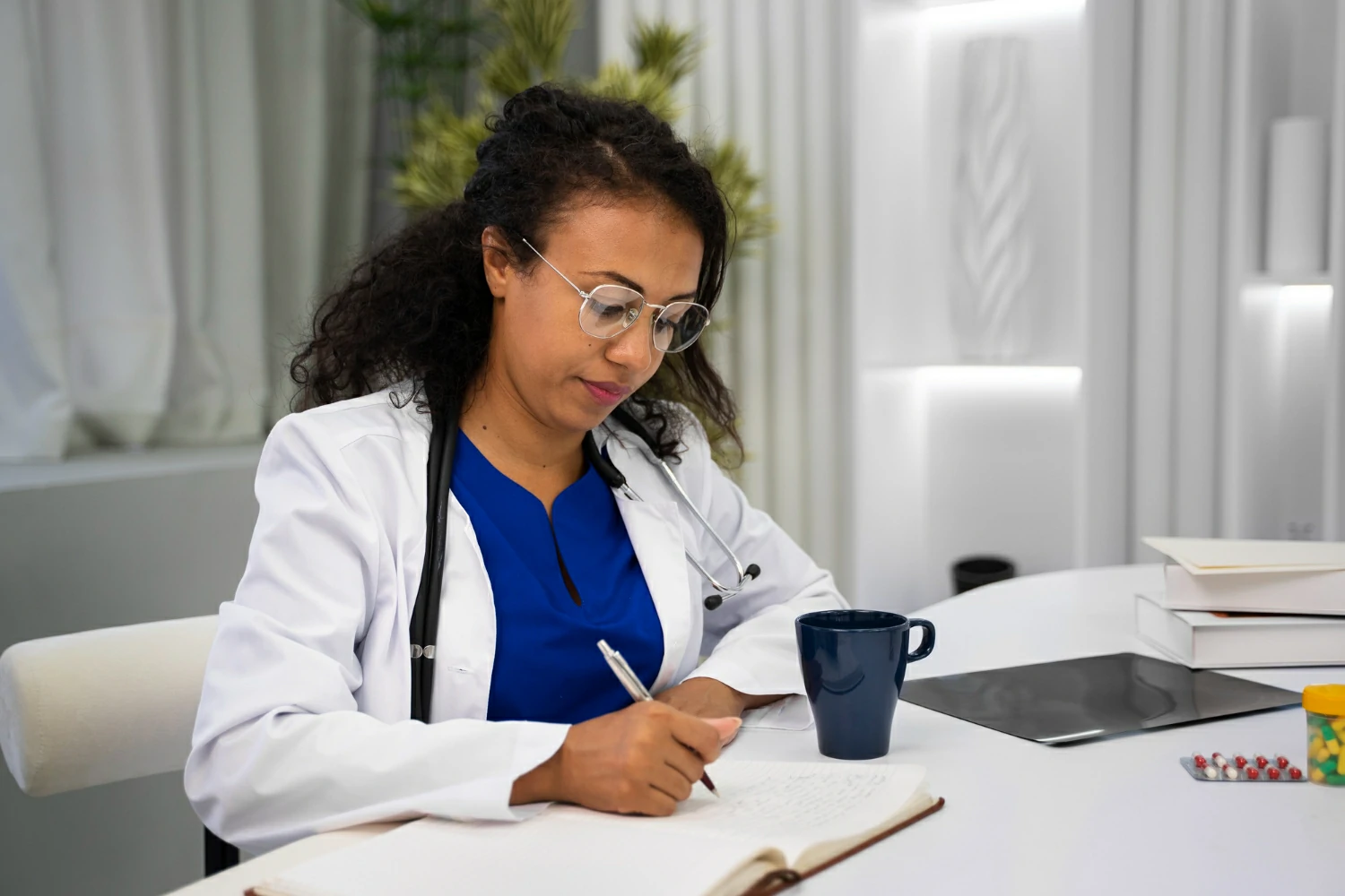 nurse in office writing